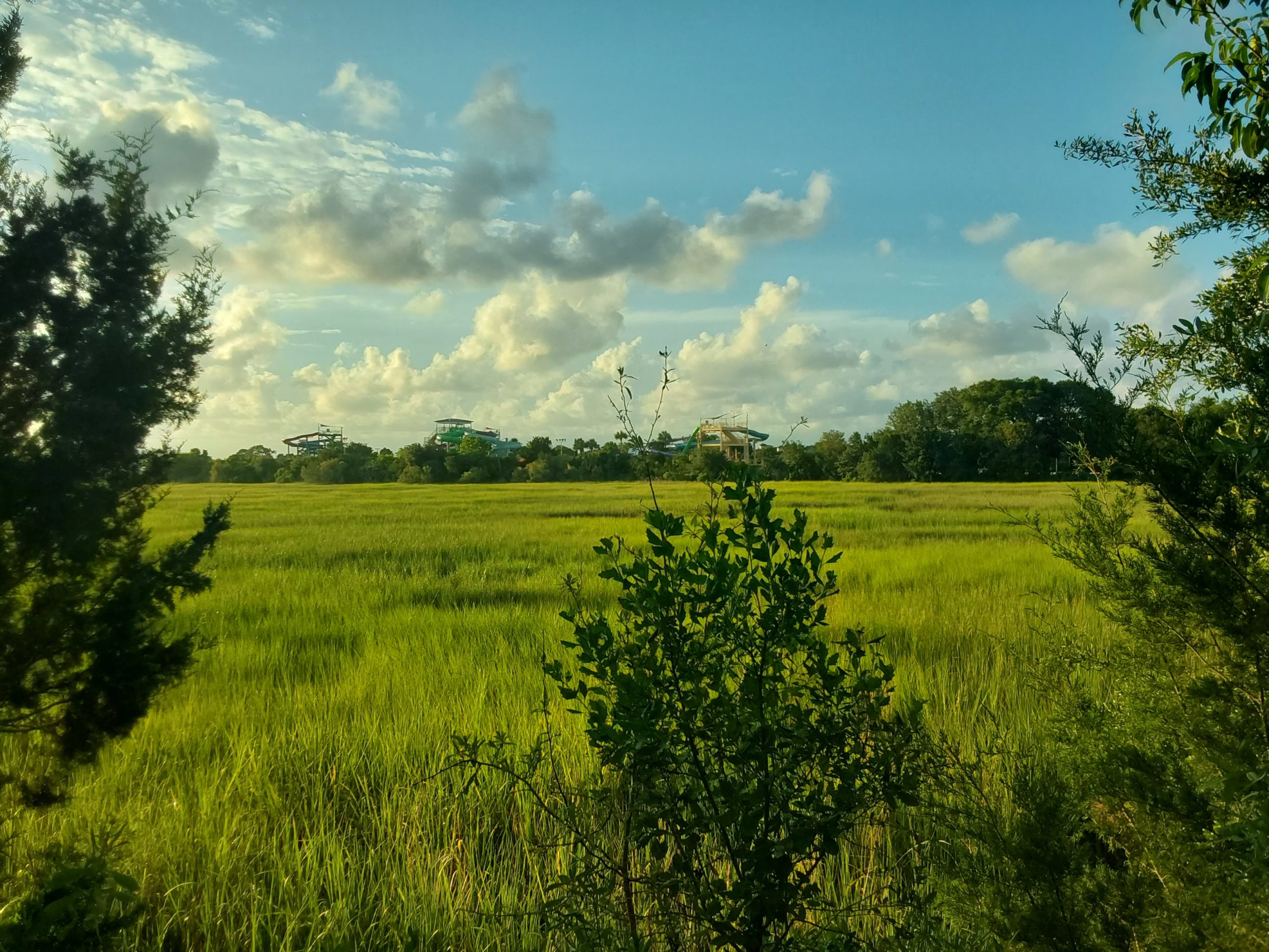 A view of marsh grass stretching out to a water park closed down waiting for summer to begin showing the beauty of The Golden Isles.